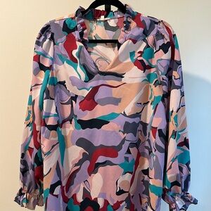 Bright colors. Super fun fabric SZ medium. Silky, soft and fun to wear.